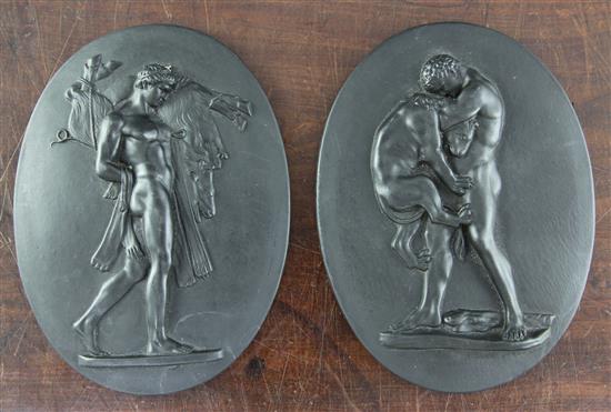A pair of Wedgwood black basalt oval plaques, late 18th century, 7.3in., one damaged